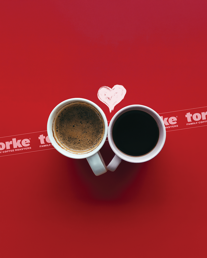 Two coffee cups on a red background with 'torke' branding.