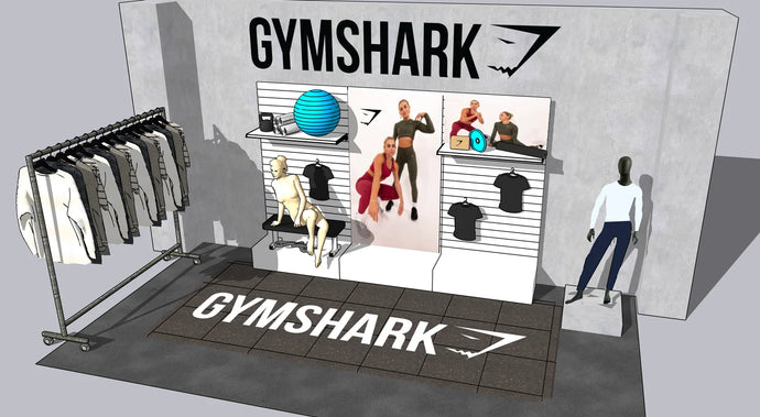 Gymshark store display with clothing racks and mannequins in a stylized setting.