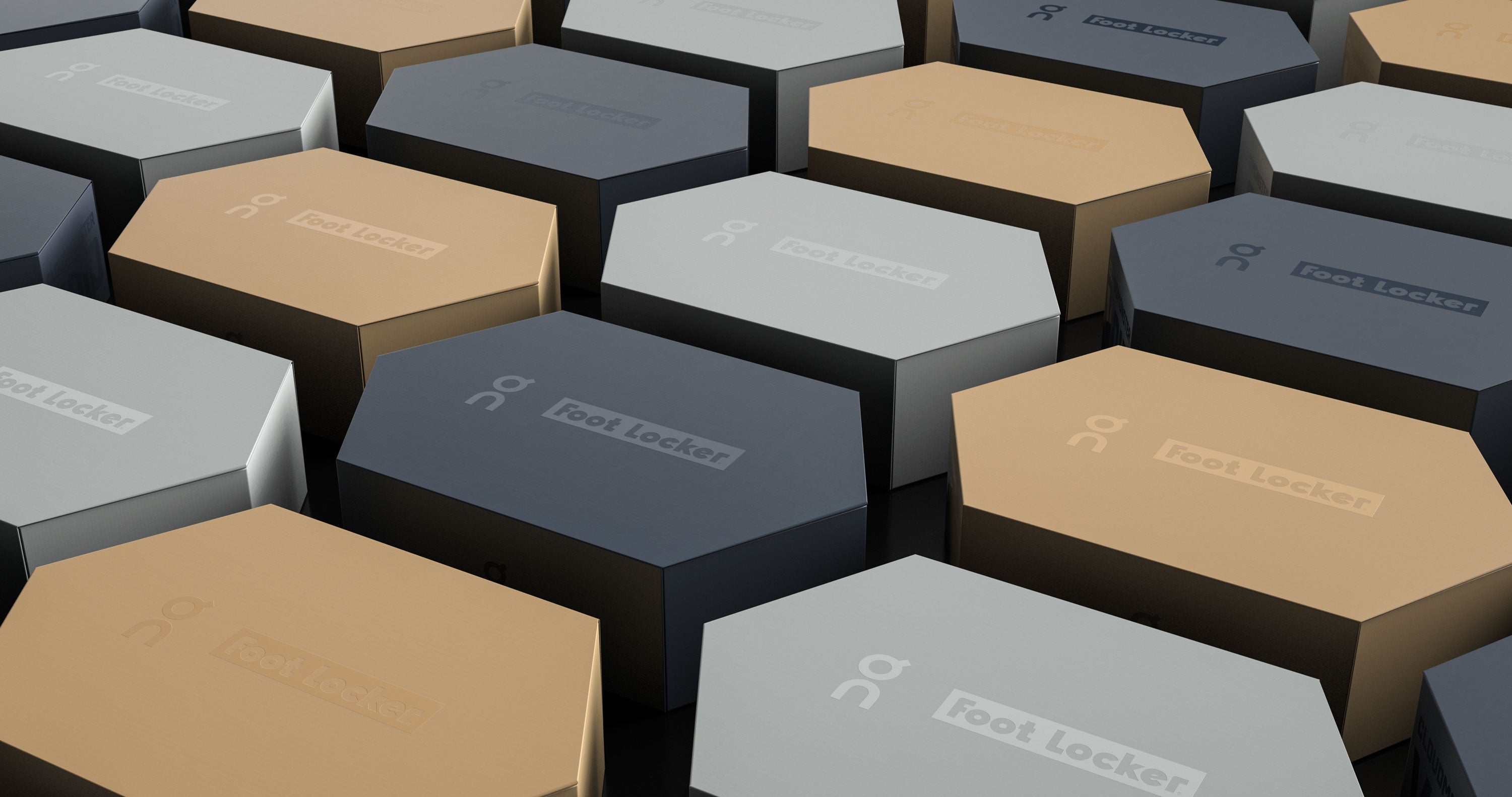 Hexagonal Foot Locker boxes in tan, grey, and dark blue, stacked and angled.