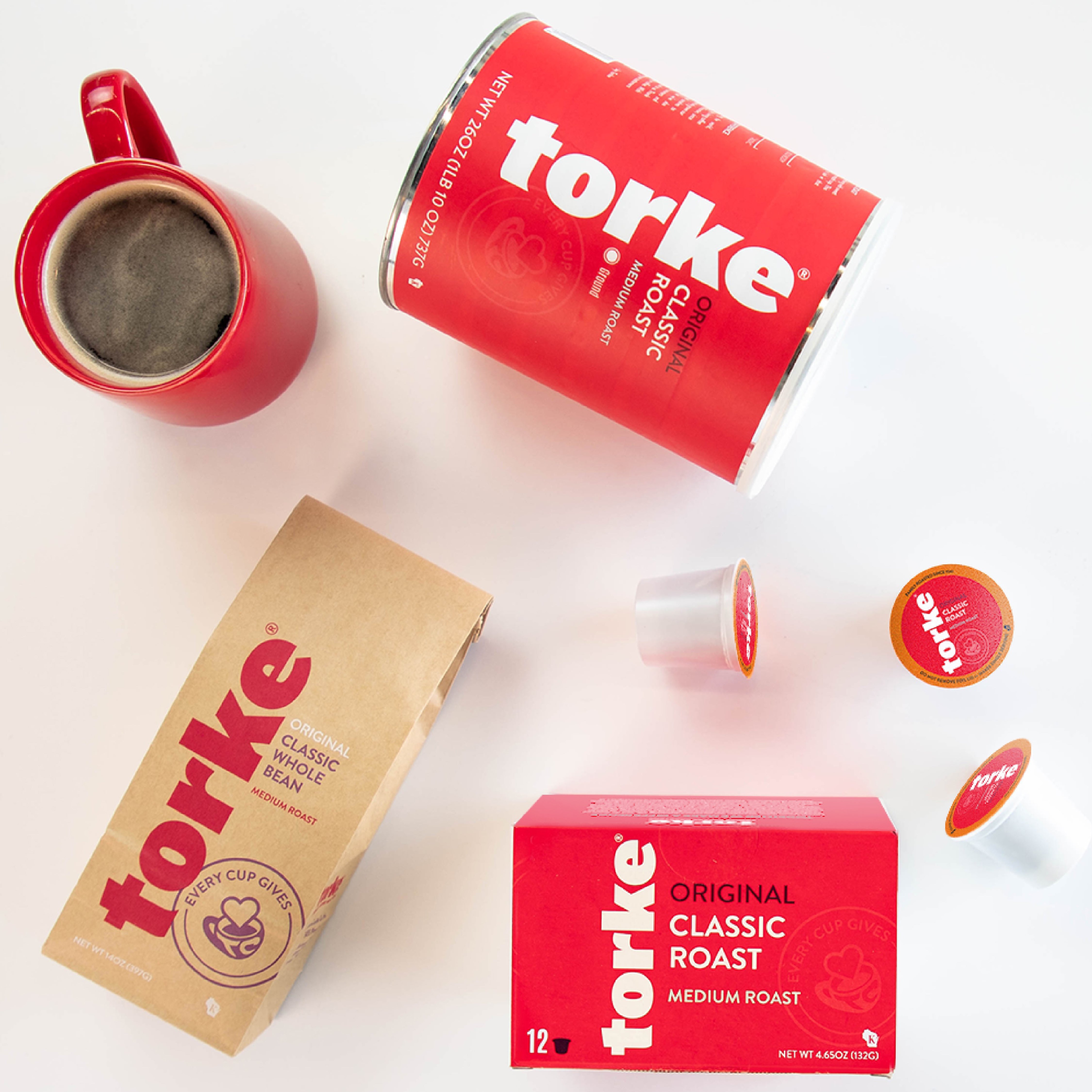 Torke coffee products including a red mug, can, and boxes on a white background